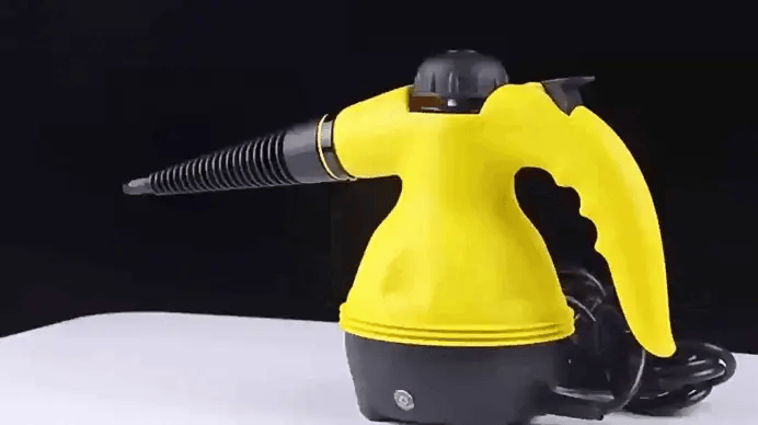 Close-up of handheld steam cleaner nozzle with high-pressure steam output for precision cleaning.