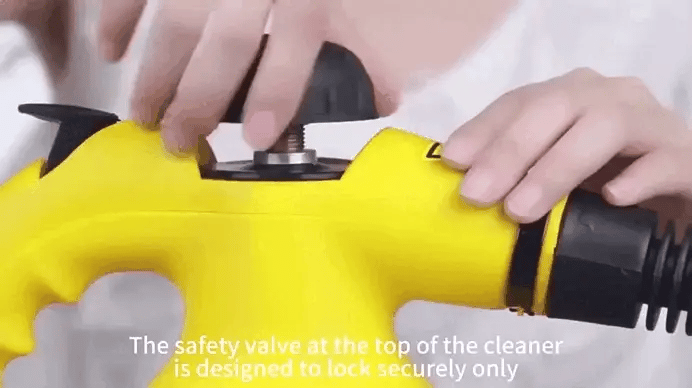Detail of steam cleaner's precision nozzle removing tough stains from stove or kitchen appliance.