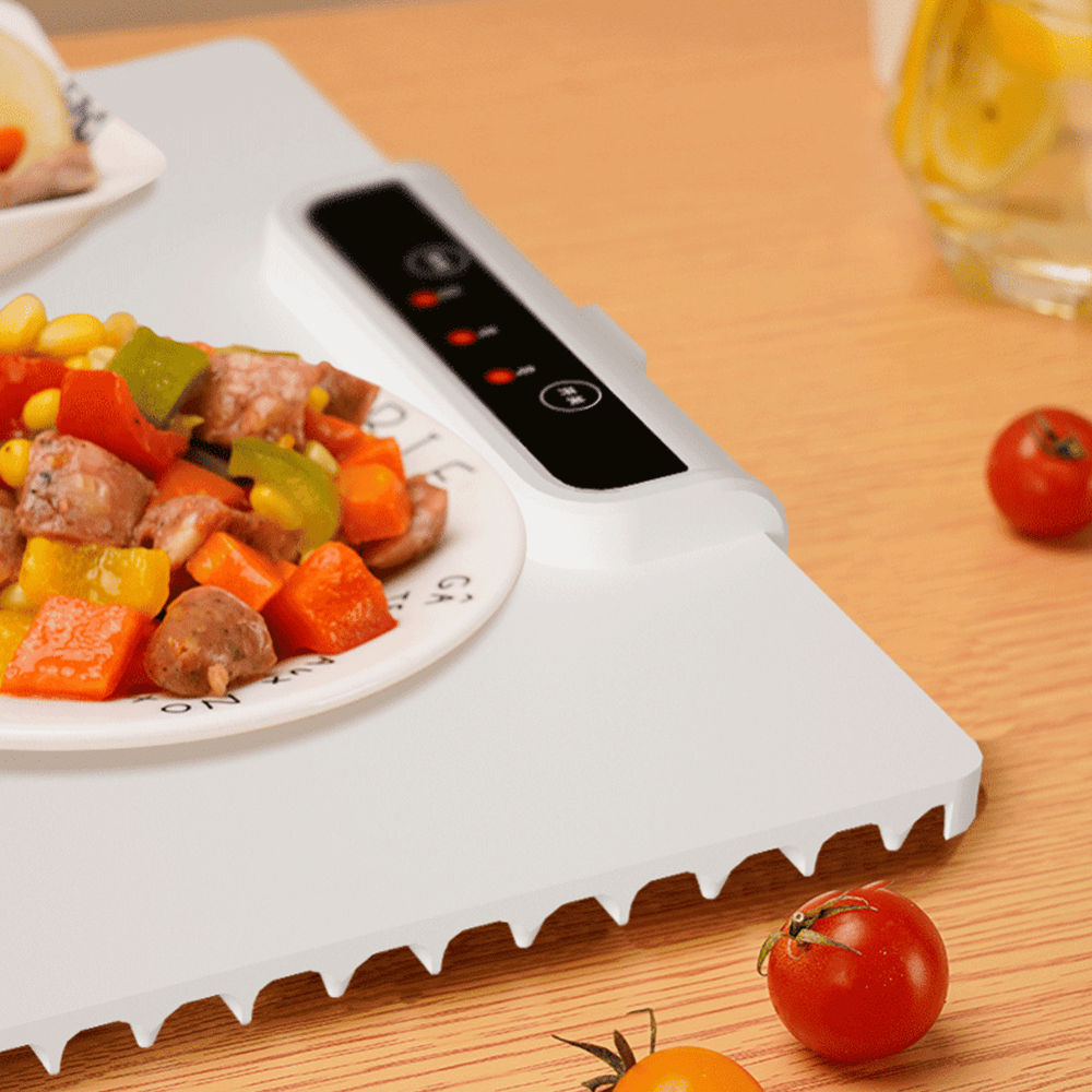 Close-up of Foldable Food Warmer heating a plate of stew with digital temperature control
