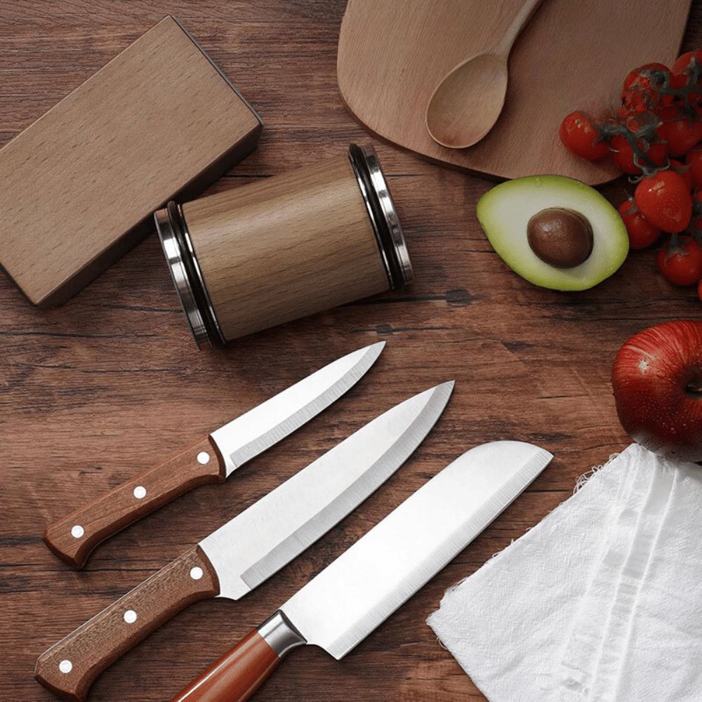 Sharpening tool on kitchen counter with various knives, demonstrating daily use practicality.