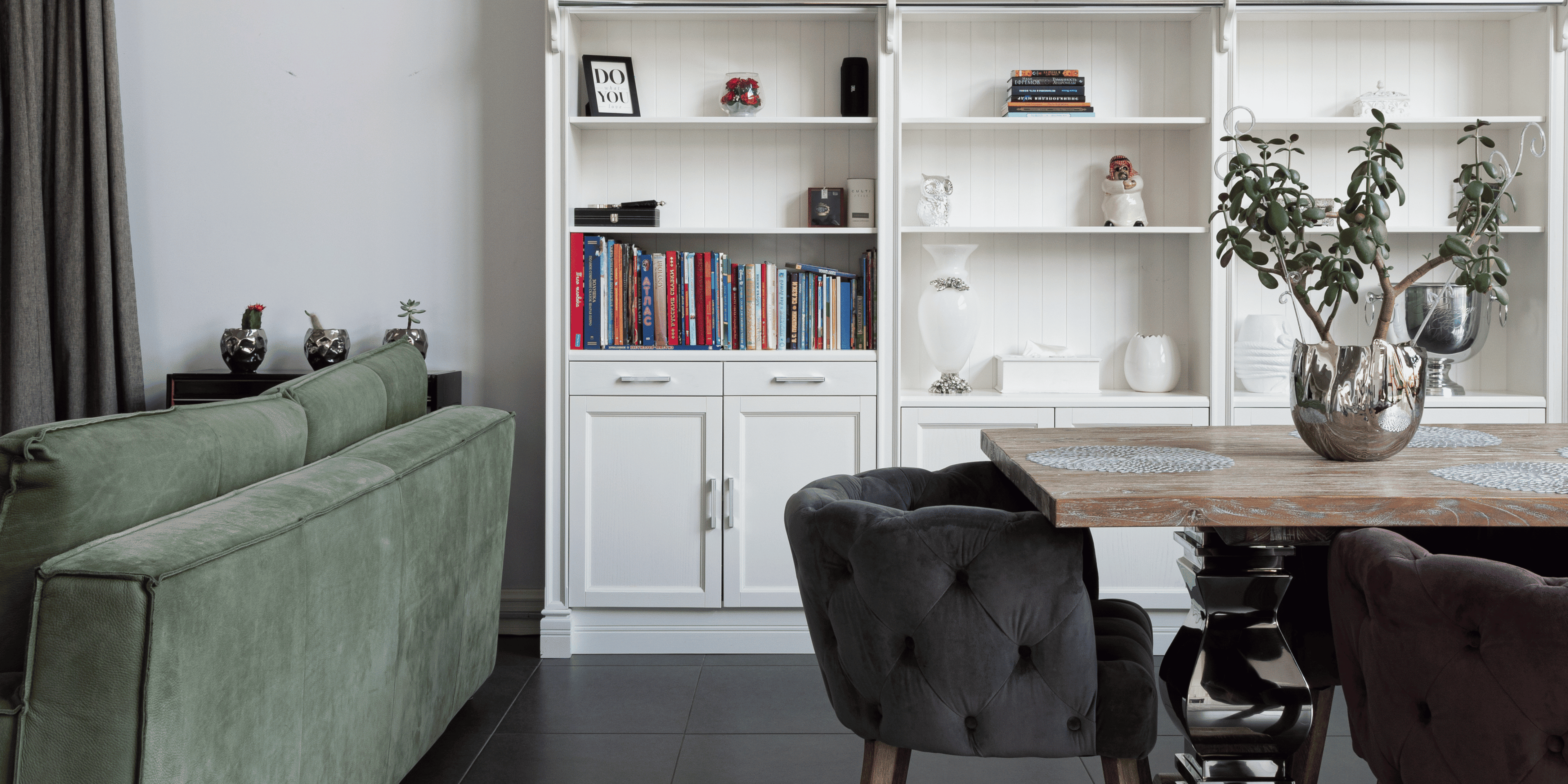 Home library and lounge corner with comfy chair and built-in bookshelf, emphasizing organized living.