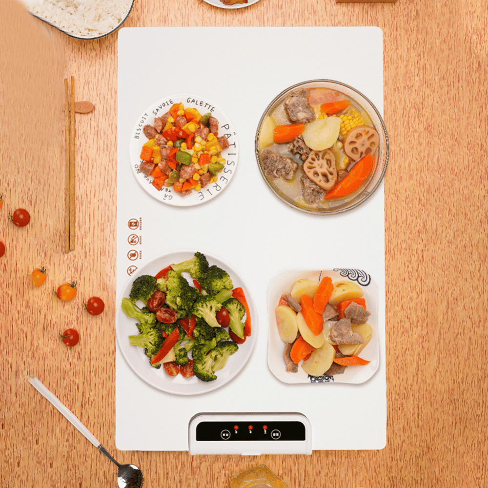 Top-down view of Foldable Food Warmer with four plates of food evenly heated on its surface