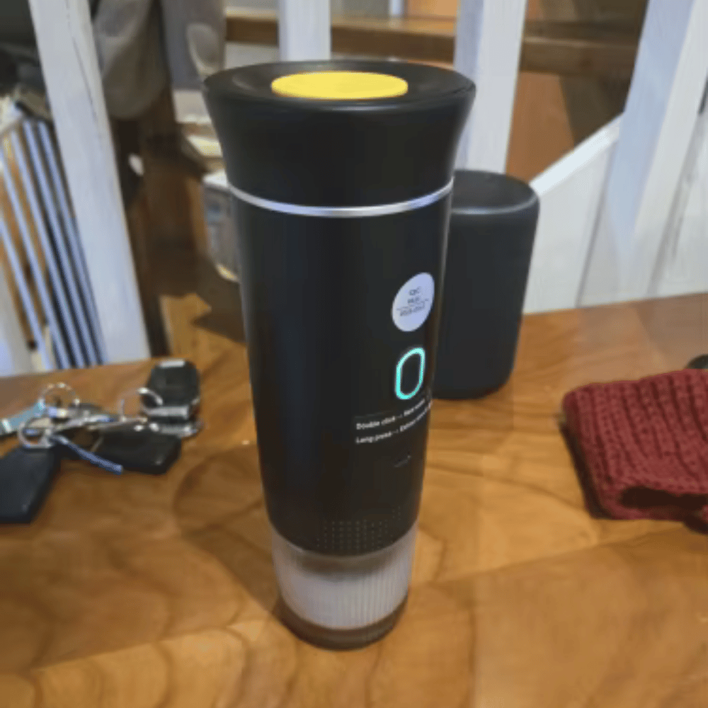 Portable espresso machine for on-the-go coffee brewing, compact design ideal for daily use at work or travel.
