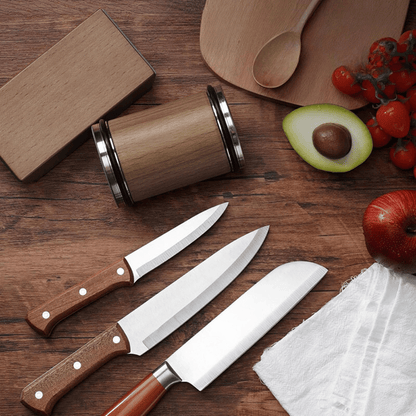 Sharpening tool on kitchen counter with various knives, demonstrating daily use practicality.