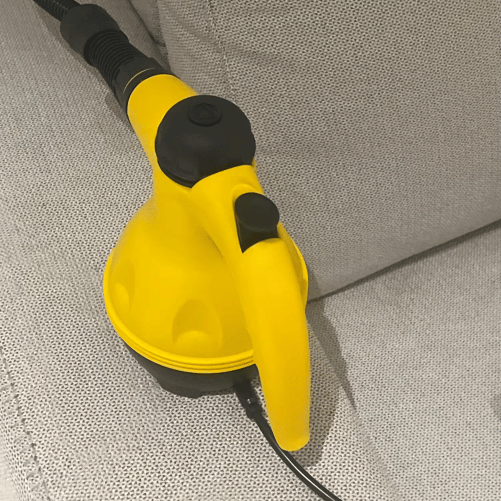 Handheld steam cleaner for home use, lightweight yellow design ideal for deep grout cleaning and sanitizing surfaces.