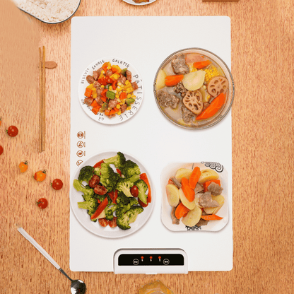 Top-down view of Foldable Food Warmer with four plates of food evenly heated on its surface
