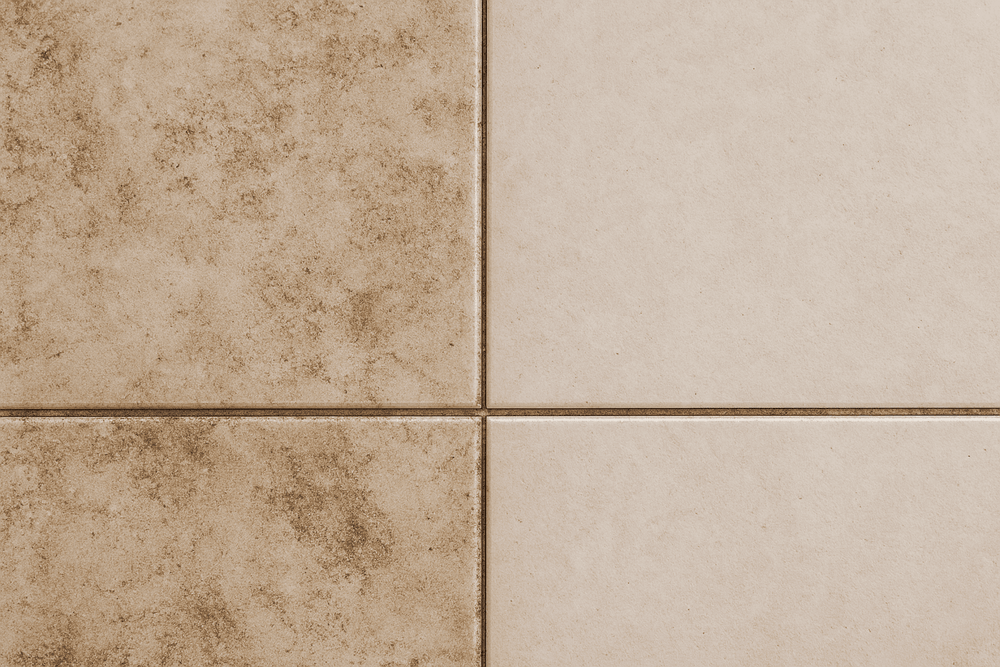 Before-and-after result of steam cleaner removing grime from dirty floor tiles.